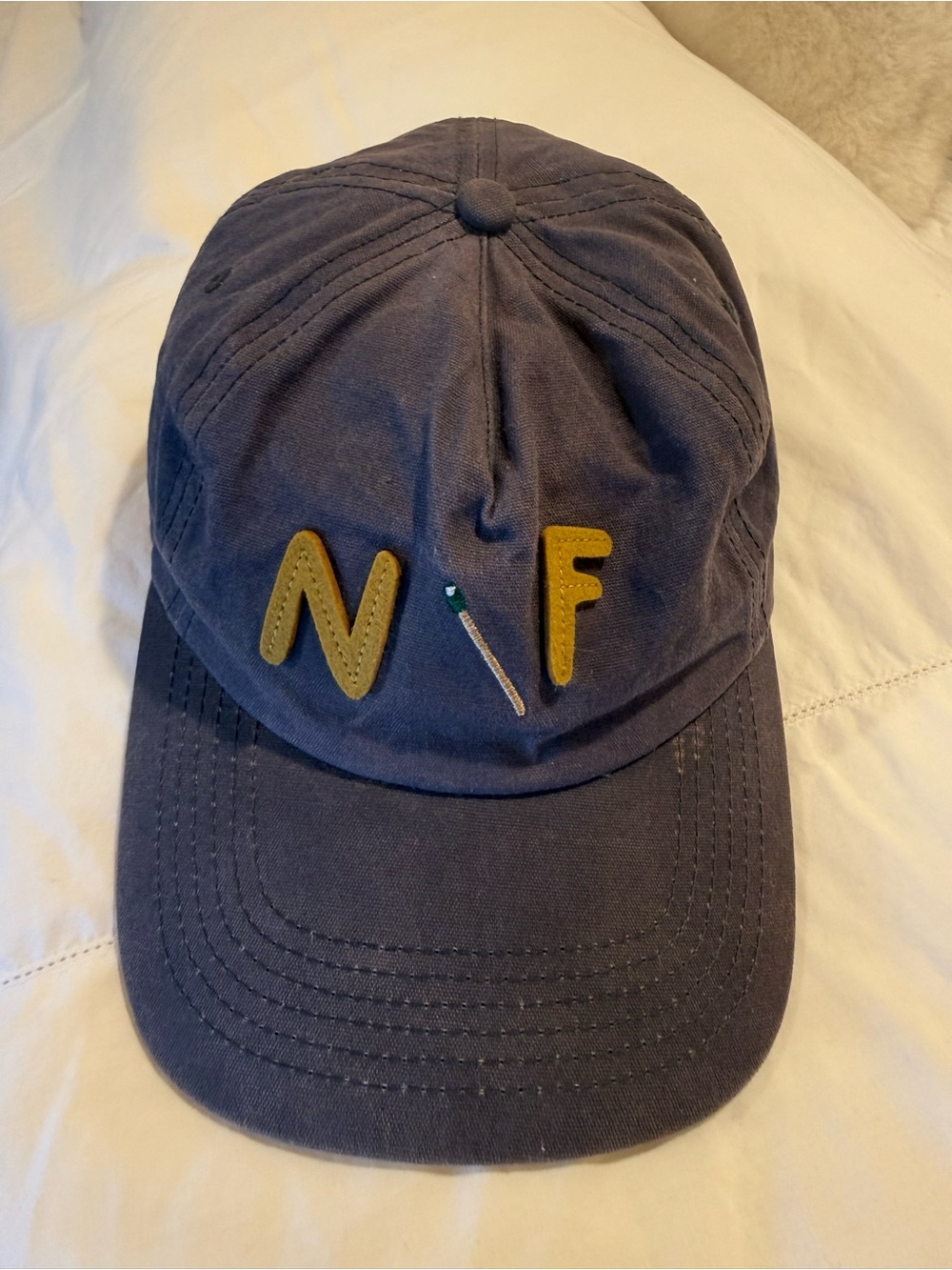 Nick Fouquet Navy Cap with Green Crest Patch
